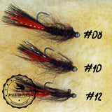 Black and red balanced leech for trout fishing on still water